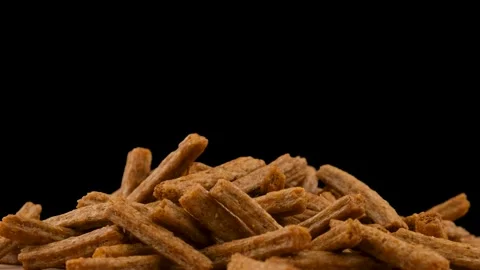 Breadcrumbs rotate on a black background. Beer snack. Close up Stock Footage 135675116