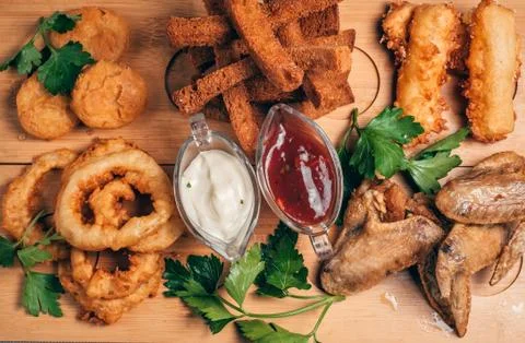 Breaded appetizers and crackers Stock Photos