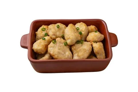 Breaded chicken bites in a plate isolated over white background Stock Photos