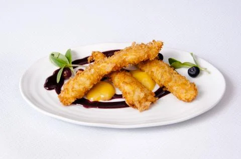Breaded chicken dish on a white background Stock Photos