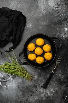 Breaded chicken fillet and batter on black dark stone table background, top view Stock Photos