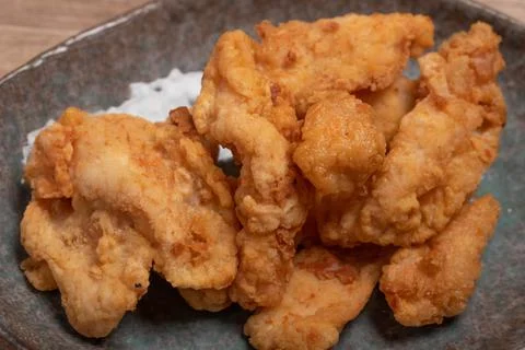 Breaded chicken fillet and batter. Delicious crunchy, hearty meat appetizer.I Stock Photos