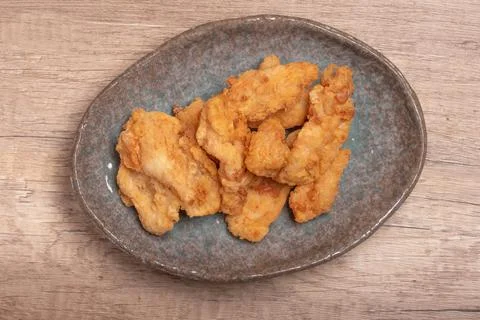 Breaded chicken fillet and batter. Delicious crunchy, hearty meat appetizer.I Stock Photos