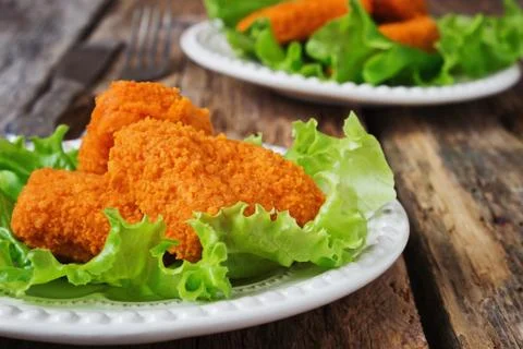 Breaded chicken fillet Stock Photos