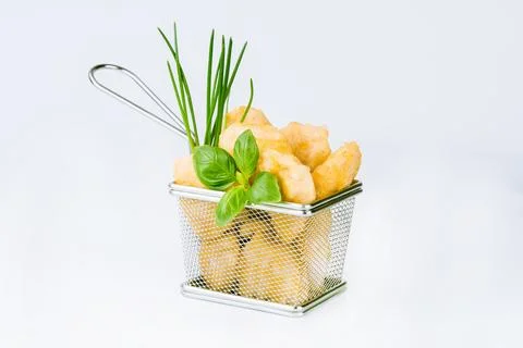Breaded Chicken Inner Fillet on a White Background,Chicken Breaded Raw Meat Stock Photos