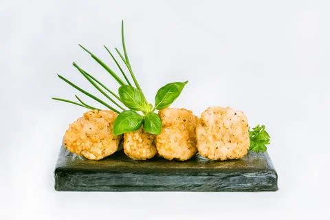 Breaded chicken nuggets. Breaded Chicken Inner Fillet with green lettuce leaves Stock Photos