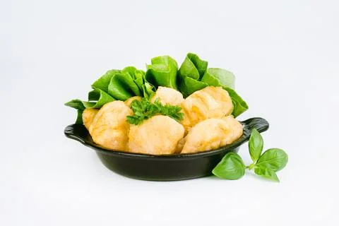 Breaded chicken nuggets. Breaded Chicken Inner Fillet with green lettuce leaves Stock Photos