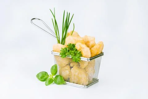 Breaded chicken nuggets. Breaded Chicken Inner Fillet with green lettuce leaves Stock Photos