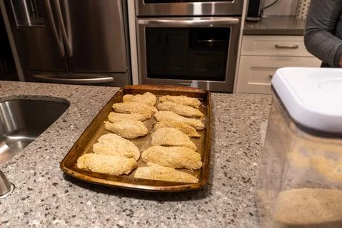 Breaded chicken prepared for the oven Stock Photos