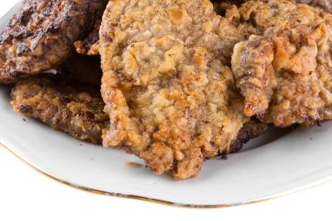 Breaded chicken schnitzel on a plate Stock Photos