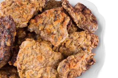 Breaded chicken schnitzel on a plate Stock Photos