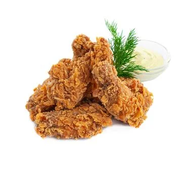 Breaded chicken wings. Deep-fried with herbs and garlic sauce. Close-up. Isol Stock Photos