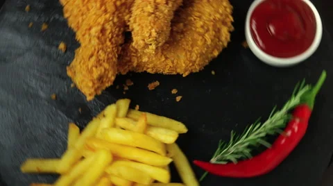 Breaded crispy chicken leg fried french fries sauce Stock Footage 67993896