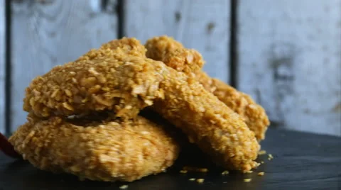 Breaded crispy chicken wing nuggets fried  sauce food dish Stock Footage 68116858