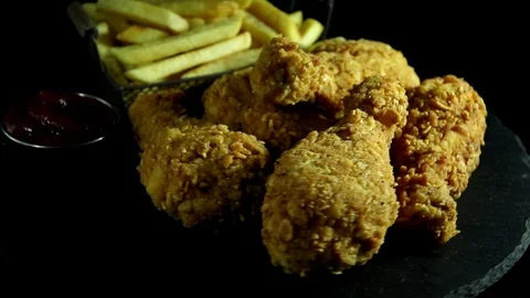 Breaded crispy fried chicken legs, french fries and sauce  rotation 360 degrees. Stock Footage 123965164