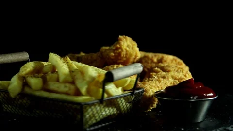 Breaded crispy fried chicken legs and french fries sauce,  rotation 360 degrees. Stock Footage 124158586