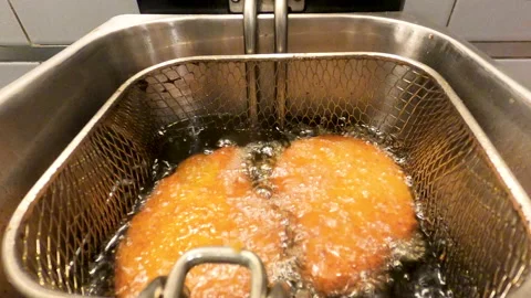 Breaded fillets being made in the fryer Stock Footage 130462547