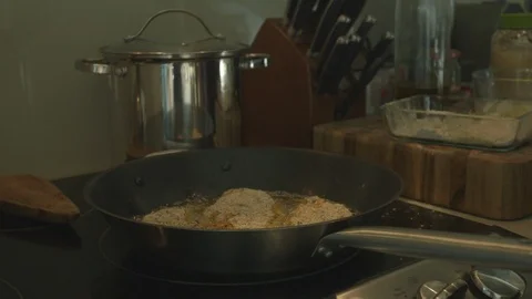 Breaded Fish Frying In Pan On Stove Stock Footage 121287295