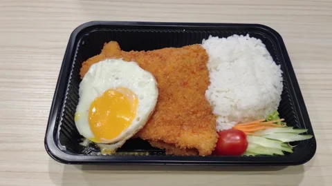 Breaded fried fish fillet served with steamed white rice Stock Footage 343200806