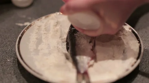 Breaded haddock being fried in a pan Stock Footage 58562609