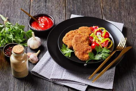Breaded lamb chops baked in an oven Stock Photos