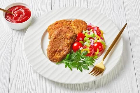 Breaded lamb chops served on a plate Foto stock