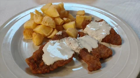 Breaded meat with cabrales blue cheese and potatoes Stock Footage 313383008
