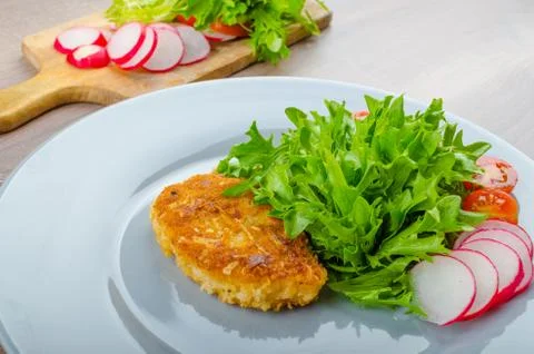 Breaded pork chops in parmesan cheese Stock Photos