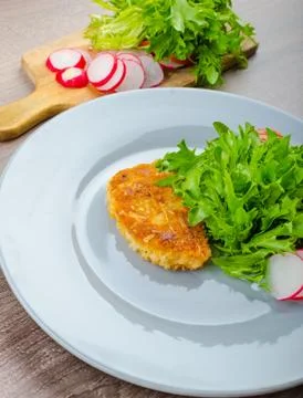 Breaded pork chops in parmesan cheese Stock Photos