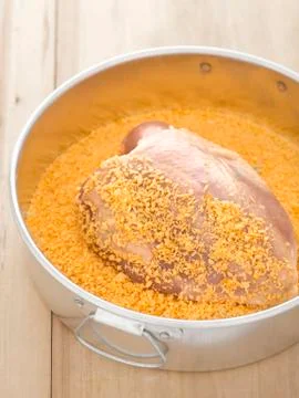 Breaded raw chicken breast Stock Photos