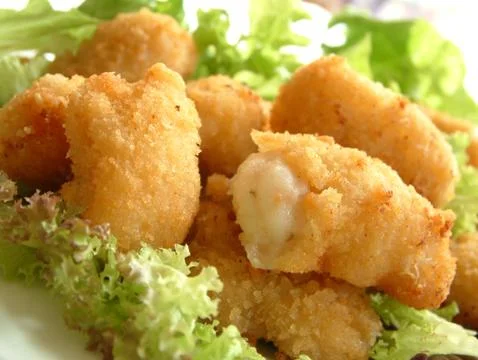 Breaded scampi tails Stock Photos