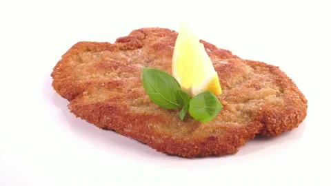 Breaded Schnitzel with Lemon isolated on white Background Stock Footage 195520141