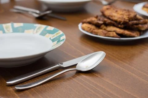 Breaded steaks served with fried potatoes Foto stock