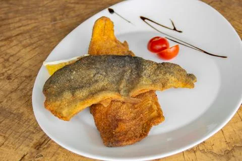 Breaded tenderloin of trout. Stock Photos
