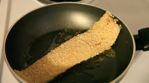 Breaded Tilapia Fish Flipped in Pan Stock Footage 533690