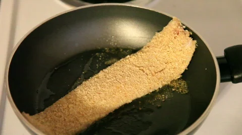 Breaded Tilapia Fish Frying in Pan Stock Footage 533706
