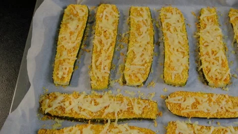 Breaded Zucchini Sticks with Cheese on Baking Sheet in Cooking Kitchen Stock Footage 341451299