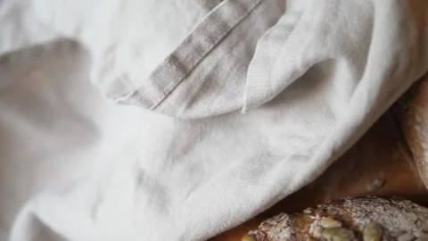 Breadfresh sourdough bread on kitchen table birdseye view pan right Stock Footage 196000150