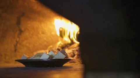 Breadfruit in Brick Oven Stock Footage 79976449