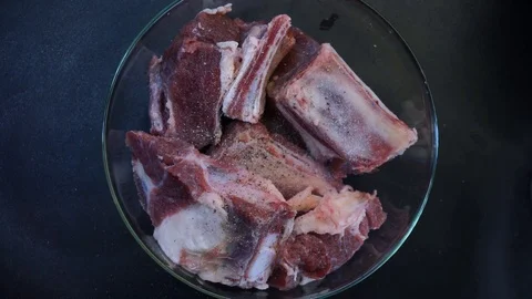 Breading beef ribs in flour overhead Stock Footage 120462222
