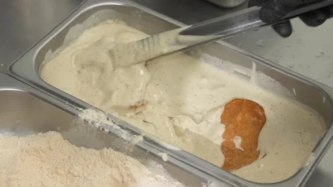 Breading Chicken in a Commercial Kitchen Stock Footage 331633799