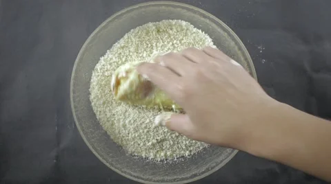 Breading Chicken with Crumbs Stockbeeldmateriaal 61323580