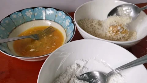 Breading a Chicken Nuggets with a Breadcrumbs Stock Footage 231360810