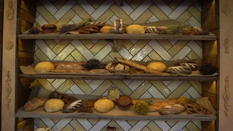 Breads and baked goods large assortment in bakery shelves Video stock 120521706