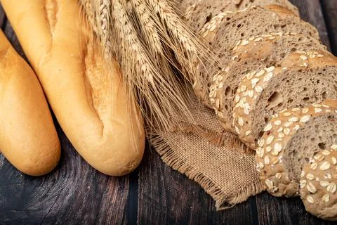 Breads and wheatgrass on the sack Stock-Fotos