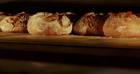 Breads baking in the oven at a bakery 4K. Stock Footage 221566433