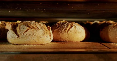 Breads baking in the oven at a bakery close-up in 4K. Stock Footage 221566055