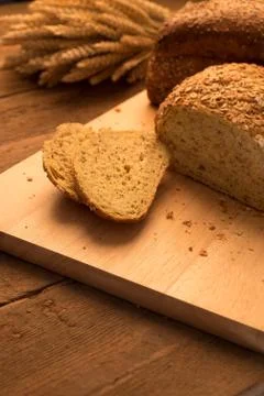 Breads on chopping board Stock Photos