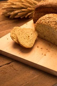 Breads on chopping board Stock Photos