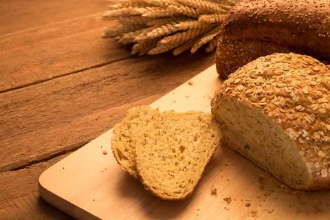 Breads on chopping board Stock Photos